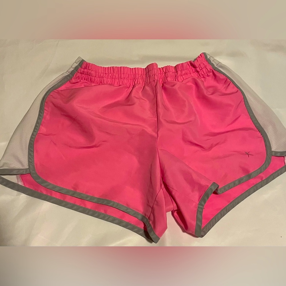 The brand is Danskin now. The shorts are a pink, white, and grey color.